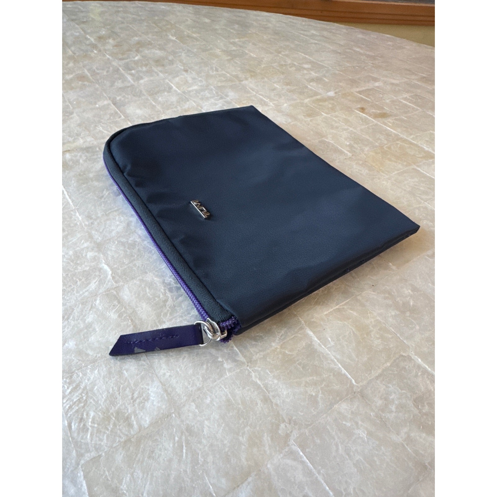 Tumi travel bag black and purple w silver logo zip around toiletry case pouch