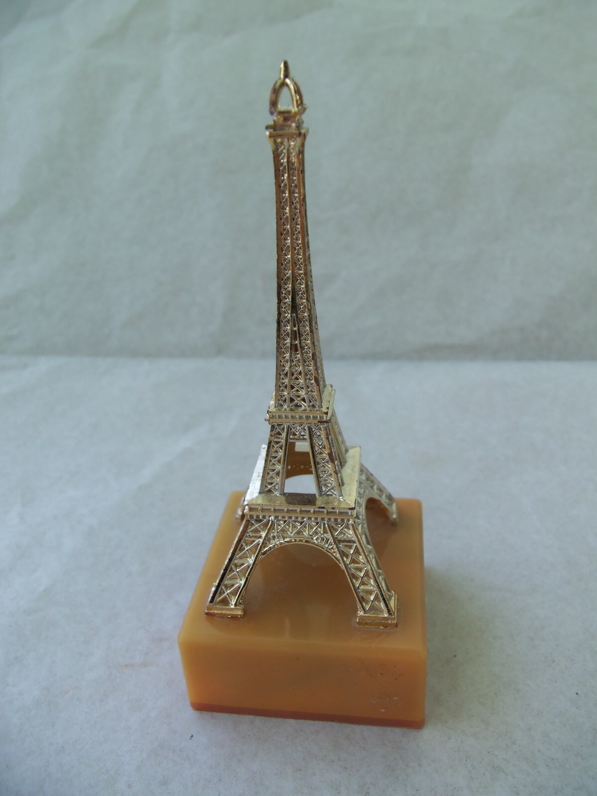 EIFFEL TOWER Souvenir from Paris France! GOLD COLOR PLASTIC! ON BASE! 4 1/4″