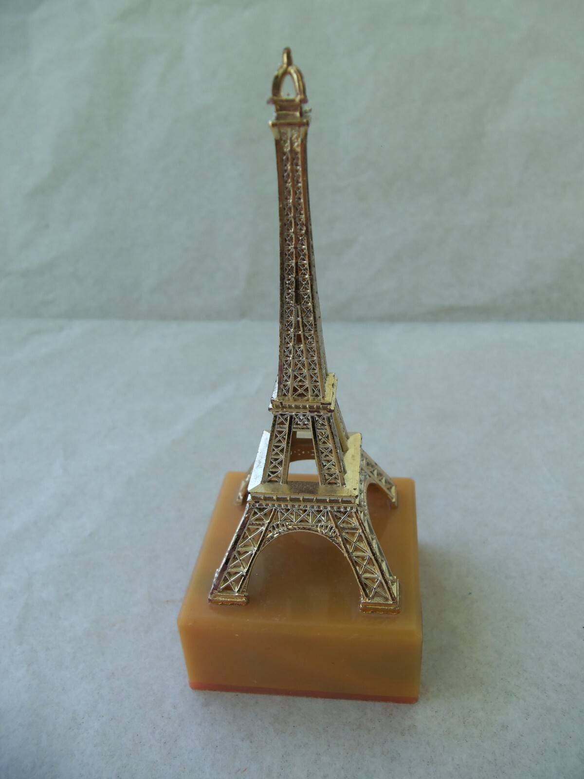 EIFFEL TOWER Souvenir from Paris France! GOLD COLOR PLASTIC! ON BASE! 4 1/4″