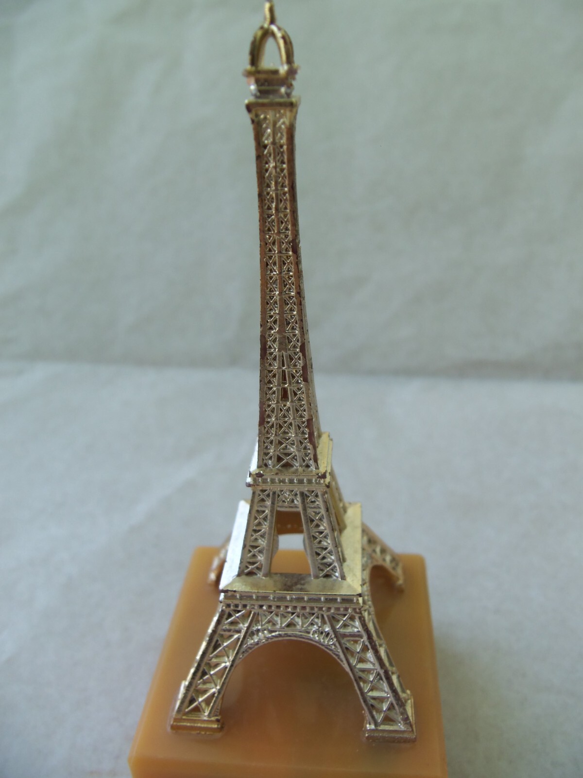 EIFFEL TOWER Souvenir from Paris France! GOLD COLOR PLASTIC! ON BASE! 4 1/4″
