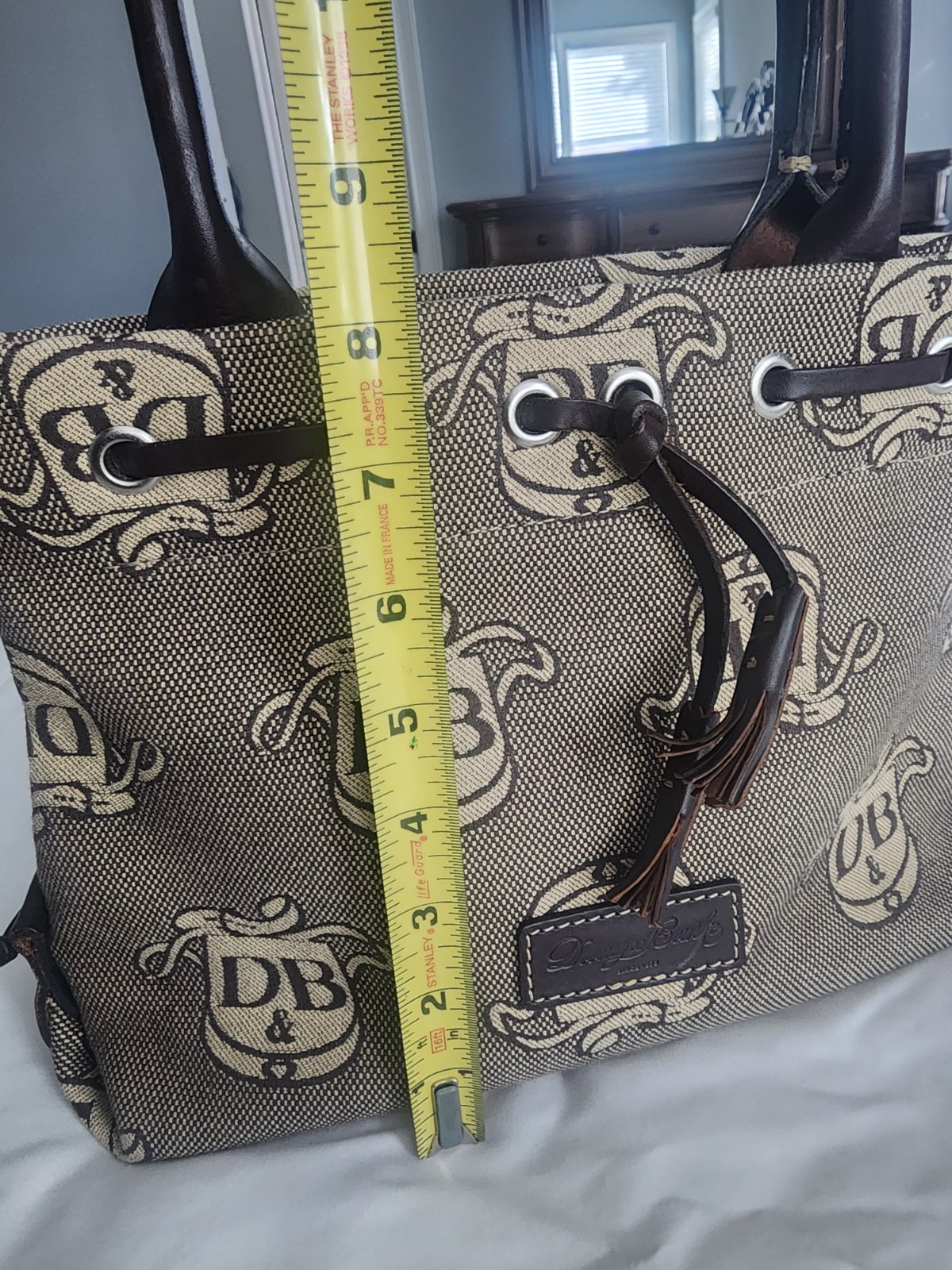 Dooney & Bourke DB Logo Dark Brown Double Handle Mini Tassel