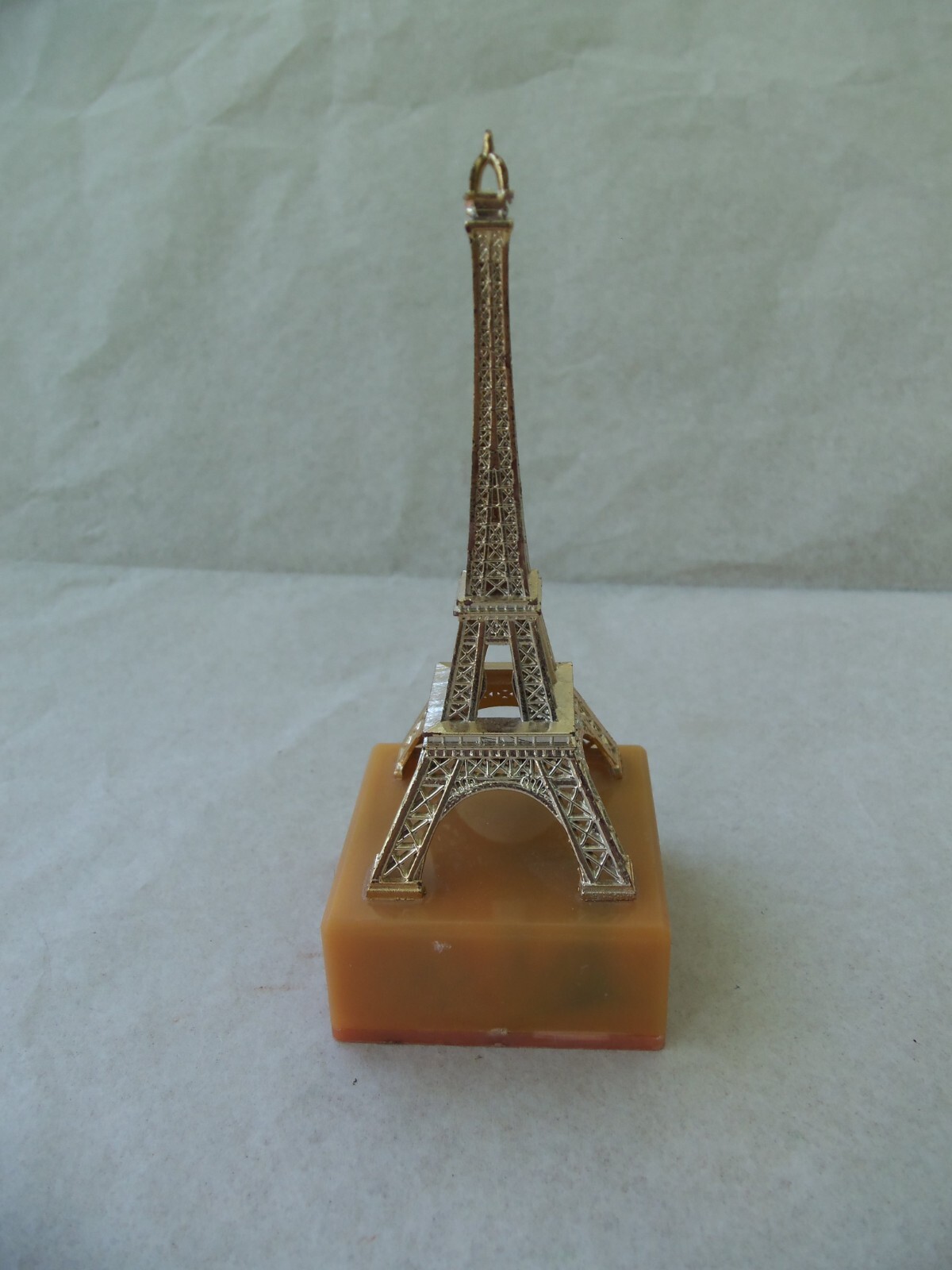 EIFFEL TOWER Souvenir from Paris France! GOLD COLOR PLASTIC! ON BASE! 4 1/4″